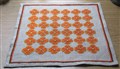 Korsstygnsblommor i orange och brunt (1).JPG